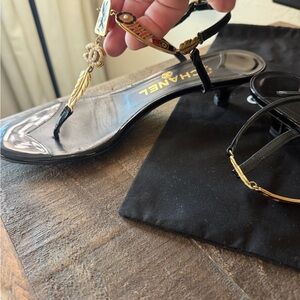 CHANEL Black Sandals with Gold Detailing